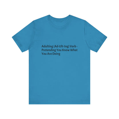 Confession: We're all just winging it. This shirt is your official adulting uniform.